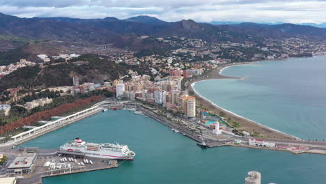 Cruise-ship-docked-in-Port-of-Malaga-Spain-aerial-view-mediterranean-sea